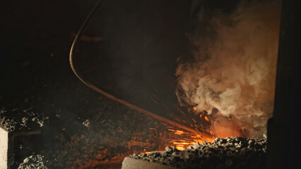 Cleaning of metallurgical plant. Stock footage. Special equipment for cleaning routes of movement of molten metals to plant. Cleaning of molten metal streams at factory