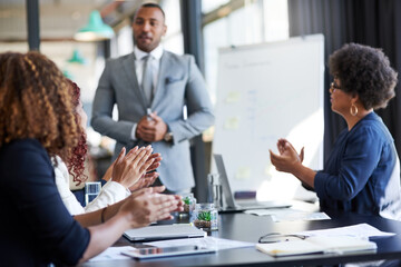 Business people, meeting and presentation with applause for congratulations, thank you or good job at conference. Young, group or employees clapping for winning, promotion or teamwork in boardroom