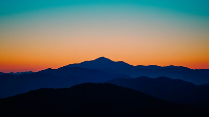 Fototapeta premium A Mountain Range Silhouetted Against The Dawn Sky Majestic And Serene.