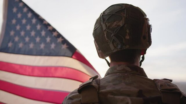 American Military Observes The US Flag At Sunset During Veteran Day Holiday