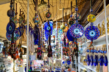 Evil eye beads, multi-colored seashells and souvenirs