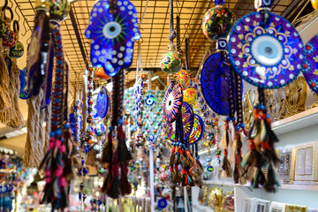 Evil eye beads, multi-colored seashells and souvenirs