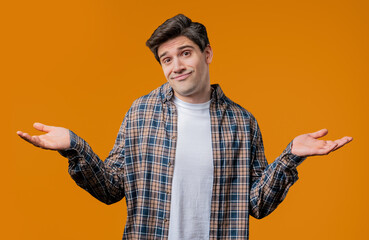 Ignorant mature 30s man, shoulders up - can't help, makes gesture I dont know