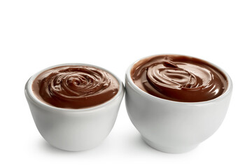 Bowls of sweet melted chocolate on white background