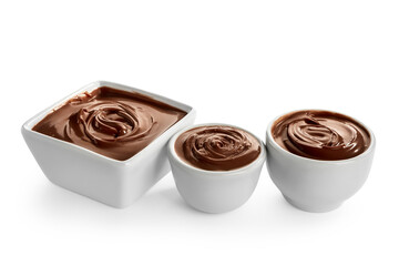 Bowls of tasty melted chocolate on white background