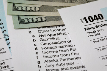 Gambling and wagering income reporting for federal income tax return. Federal tax return, income tax and tax refund concept.