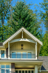 A perfect neighborhood. Houses in suburb at Fall in the north America. Top of a luxury house with nice window over blue sky.