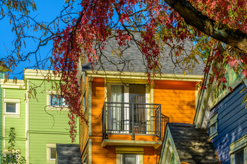 A perfect neighborhood. Houses in suburb at Fall in the north America. Top of a luxury house with...