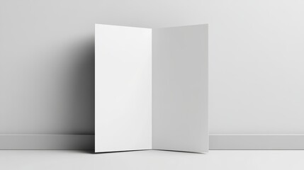Minimalist blank white tri-fold brochure template leaning against a wall showcasing front and back design for business marketing print media and branding solutions