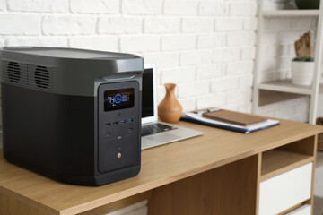 Portable power station on desk in office, closeup