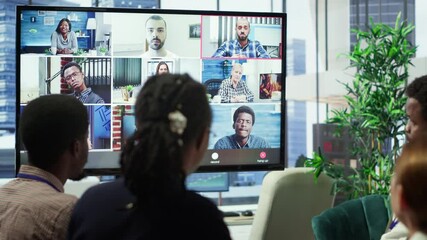 Marketing team analyzing big data insights on online videoconference with the advisory board, creating detailed infographics to present progress and goals. Remote presentation. Camera A.