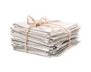 Stack of many newspapers isolated on white