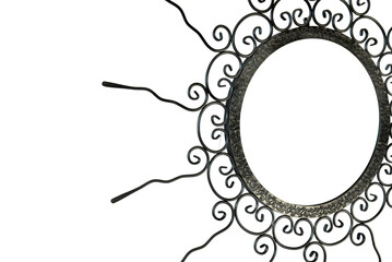 An intricate metal sunburst featuring swirling, ornamental wire rays and a circular, hollow center. The handcrafted design exudes a vintage, artisanal charm, perfect for decorative use.