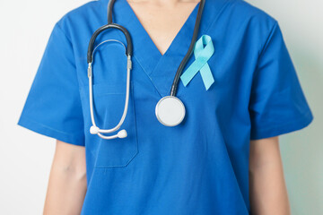 Blue November Prostate Cancer Awareness month, Doctor with Blue Ribbon in hospital for support people life and illness. Healthcare, International men, Father, Diabetes and World cancer day