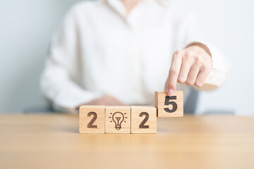 2025 block with lightbulb. Business Idea, Creative, Thinking, brainstorm, Goal, Resolution,...