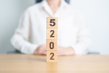 2025 year calendar block on table. goal, Resolution, strategy, plan, start, budget, mission,...