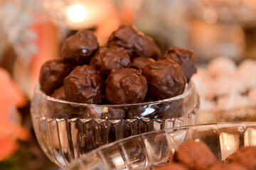 chocolate ball, chocolate with dried fruits, brigadeiro, candy table, glass bowl, candy store, showcase


