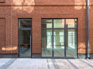 old red brick industrial building renovated into a modern office space.