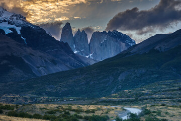 Fototapeta premium Torres del Paine in Patagonia, Chile. These iconic granite towers rise dramatically above the surrounding wilderness, creating one of the most famous landscapes in South America
