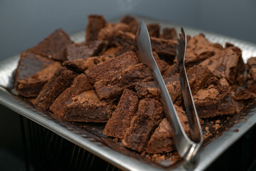 Chocolate brownie cake cut into triangles on a platter