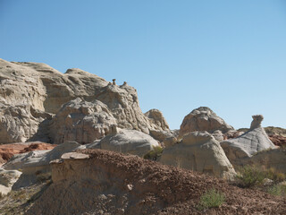 Vermilion Cliffs desert landscape with eroded rocks on sunny day with clear blue sky, Utah