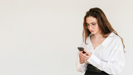 Mobile scam. Online chat. Disturbed dissatisfied business woman in glasses texting message using...