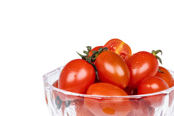 The dessert bowl is filled with fresh cherry tomatoes. white background - Solanum lycopersicum var. cerasiforme
