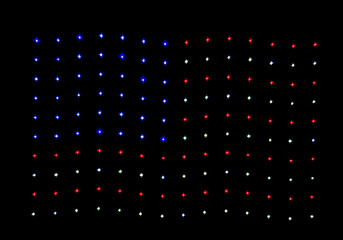 Drone show making a  United States Flag at night in Tybee Island, Georgia taken from the pier