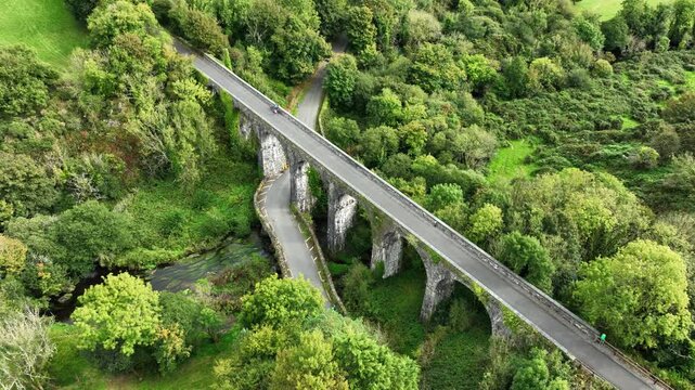 Ireland Epic Locations drone circling Durrow Viaduct with road bridge underneath and river with people cycling Waterford Greenway Route between Waterford City and Dungarvan Co. Waterford epic Ireland