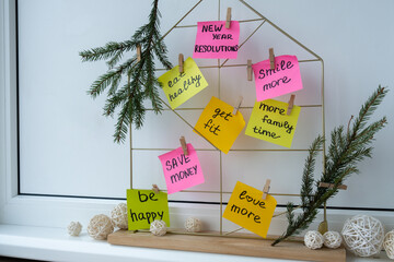 Vision board with new year resolutions aims goals on sticky notes. Preparation for New Year....