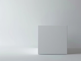 Large matte white box, square, rounded edges, diagonally placed on soft gray, gentle shadows.