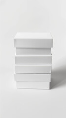 Stack of four matte white boxes, varying in size, on white background, soft shadows at the base.