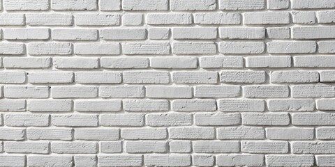 Fototapeta premium A simple white brick wall with a subtle textured finish, ideal for background design or architectural inspiration.