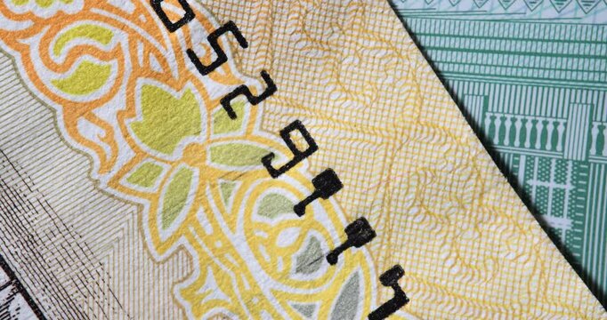 Closeup of US dollar bill serial number and security features