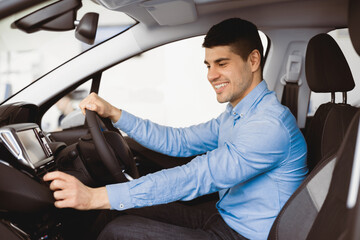 Transportation And Modern Technology Concept. Smiling man checking navigation system on car dashboard screen