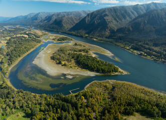 A river with a bend in it and a forest on the other side