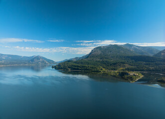 A beautiful blue lake with mountains in the background
