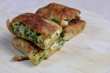 Egg Martabak or Egg Martabak. Savory fried pastries filled with eggs, meat and spices. Martabak Telur is one of the street snacks in Indonesia.