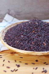 Pile of Uncooked Riceberry Rice, a Healthy Carb of Cross-breed of Jao Hom Nin Rice and Jasmine Rice of Thailand
