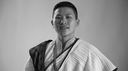 Obraz premium Black and white portrait of man in traditional attire with calm expression