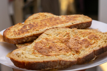 Two slices of toast with a brown crust and a golden brown interior