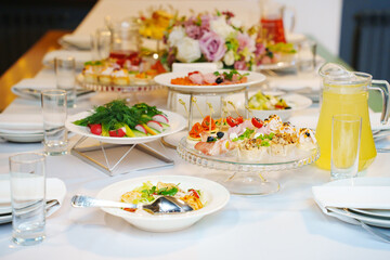 A served festive table with a variety of snacks and drinks. catering for a holiday.