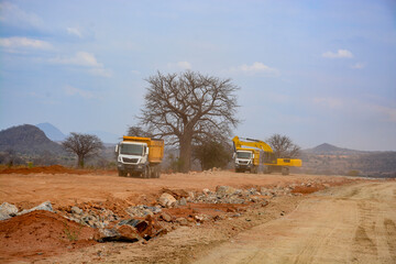truck and excavator in the desert