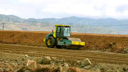 Roller compactor machine compacting ground