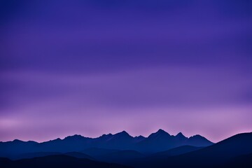 Obraz premium Jagged mountain peaks in silhouette against a bright purple and blue twilight, Ai Generated