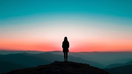 Obraz premium Woman Silhouette at Dawn on Mountain Top