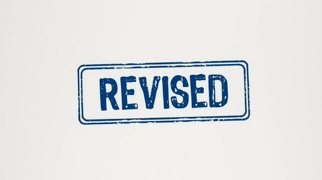 REVISED - Animated wooden stamp pressing 'Revised' onto white paper.