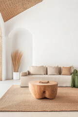 A cozy living room with a wooden coffee table and natural decor in a minimalist design setting