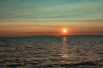 Fantastic sunset sun over Lake Baikal, summer time. Russia, Lake Baikal, Olkhon Island.