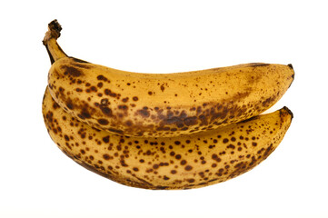 Dwa dojrzałe banany z brazowymi kropkami izolowane, z bliska, na białym tle © Paweł Kacperek